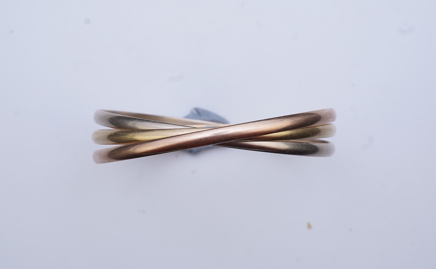 Cartier, a gold bangle, 'Trinity de Cartier'